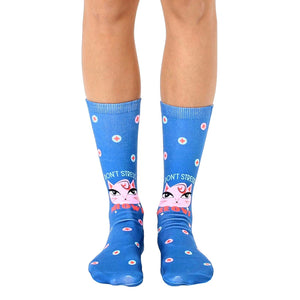Crew socks in blue with a pink cat face, 'Don't Stress Meowt' text, and teal/white polka dots.