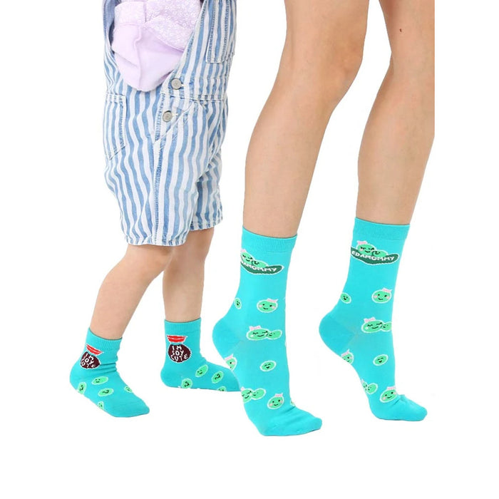 Adult and child teal crew socks.  Features cute peapod faces and 'Edamommy' text. Grippers on baby socks.