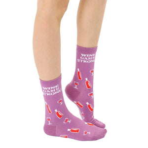 Close-up of adult 'Wine Game Strong' socks on a model's feet, showcasing the sock's design and color.