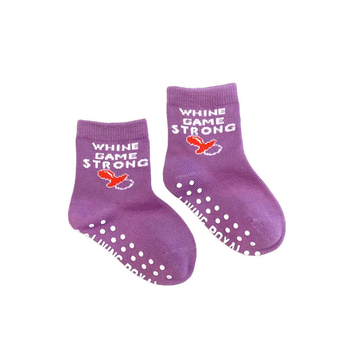 A pair of purple baby socks with white and red text that says 