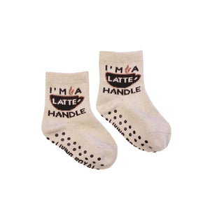 A pair of mini 'Coffee Me And Mini' socks; shows the grippers on the bottom.