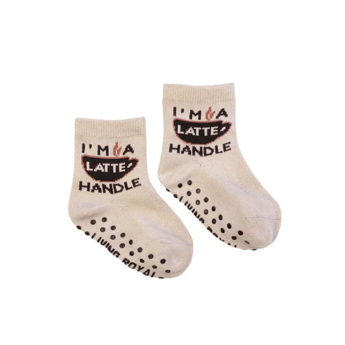 A pair of mini 'Coffee Me And Mini' socks; shows the grippers on the bottom.