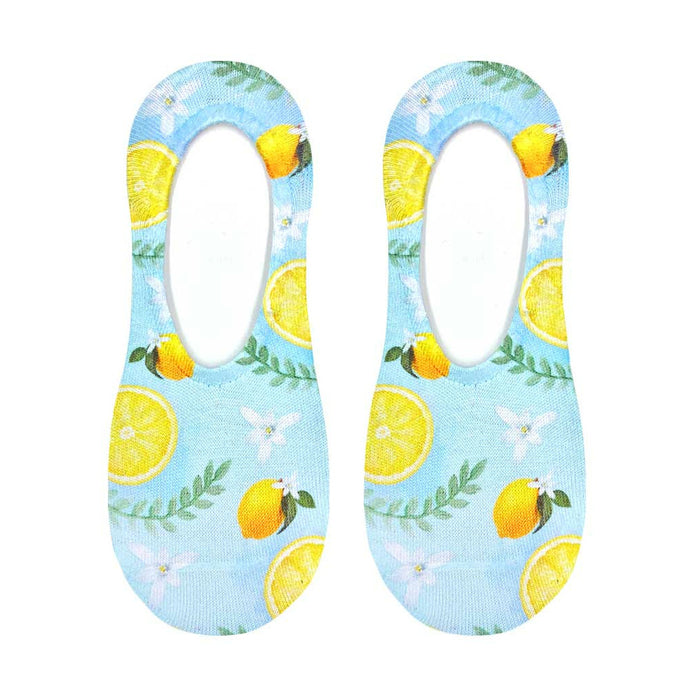 Flat lay product shot of a pair of Classy Lemon no-show socks, showcasing the full lemon and floral print design on a light blue background.