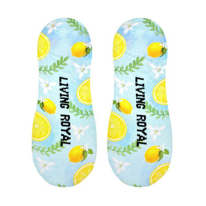 Close-up showcasing the sole of the Classy Lemon no-show socks, revealing the 'LIVING ROYAL' text incorporated into the design.
