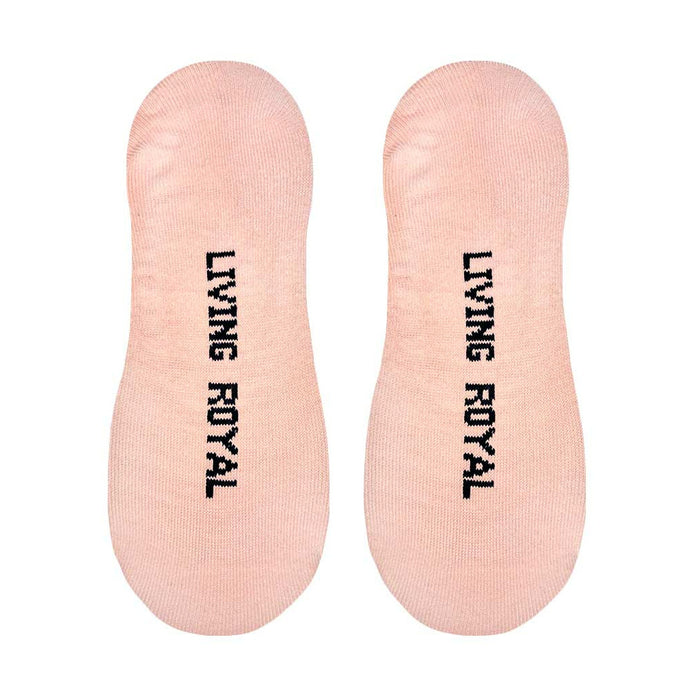 A pair of pink no-show socks with the words 