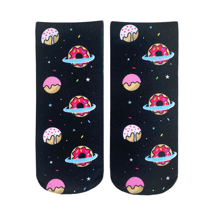 Crew socks with a black background, featuring pink, white, and red donuts orbiting in space. The donuts have sprinkles and icing. }}
