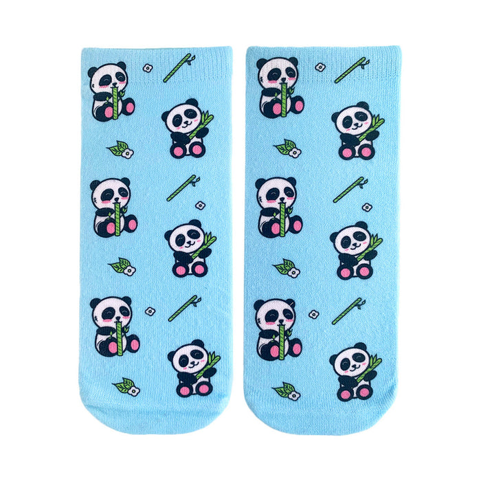Pair of light blue crew socks featuring a repeating pattern of pandas eating bamboo. Small flowers and bamboo stalks are also part of the design. }}