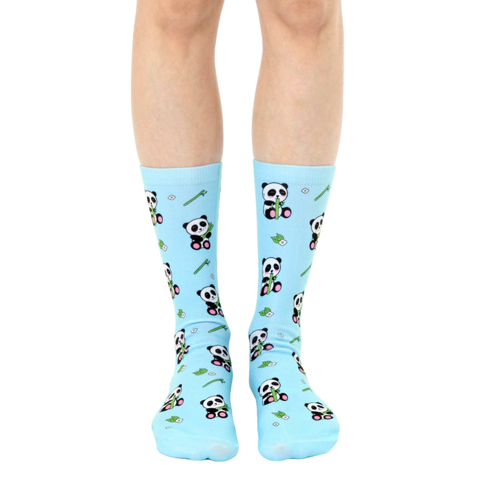 Pair of light blue crew socks with an all-over print of pandas eating bamboo.