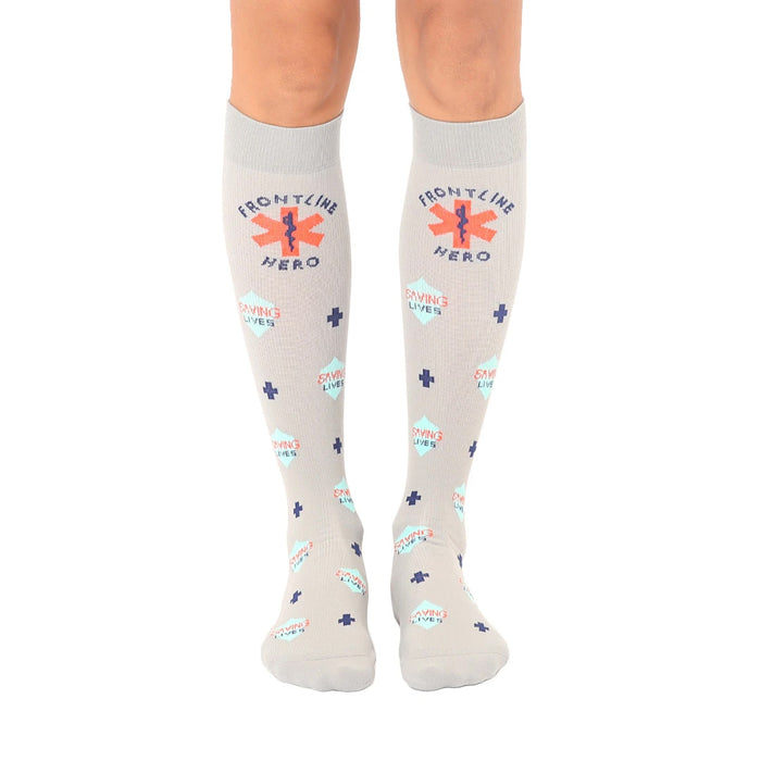 frontline hero knee-high socks show support for first responders in gray with blue, red, and orange plus signs, 
