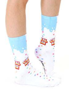 A pair of white socks with a blue top and the words 
