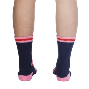 Back view of the socks on a person's legs, highlighting the design details from the back.