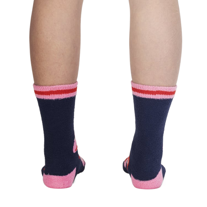 Back view of the socks on a person's legs, highlighting the design details from the back.