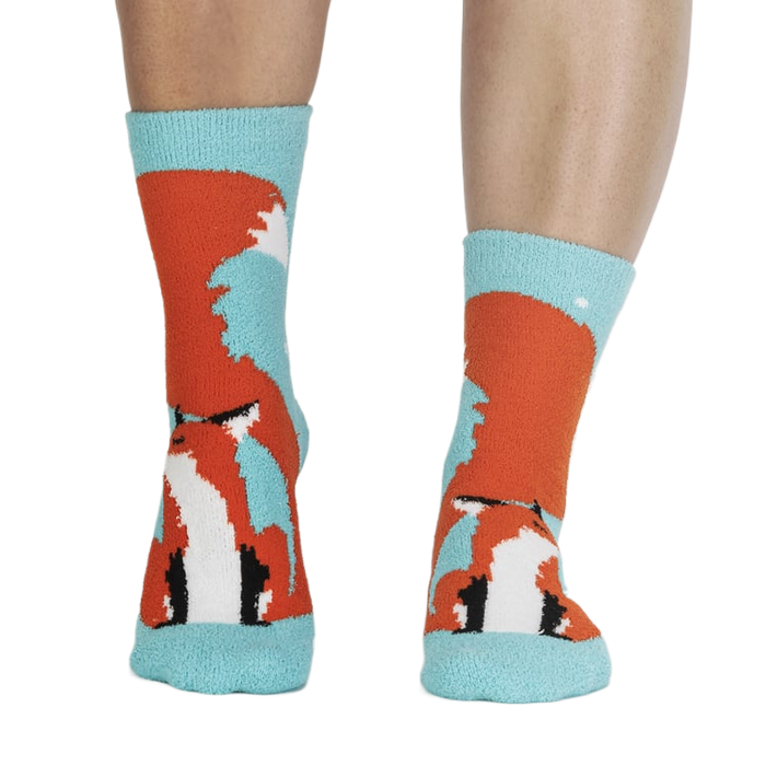 Pair of fox slipper socks on a person's legs.