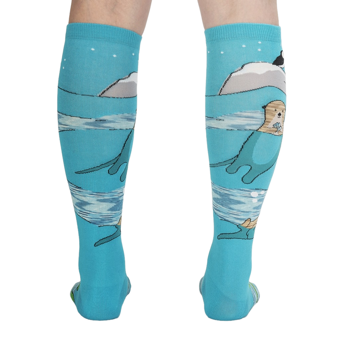 Back view of the 'Plays Well With Otters' knee-high socks highlighting the full design, including the otters and icebergs.