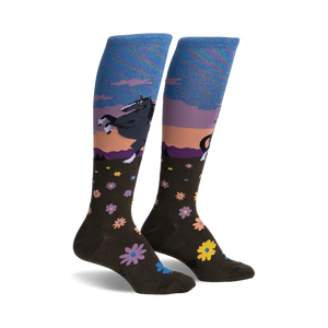 Pair of women's knee-high socks.  Olive green with a sunset scene, a dark horse, and scattered flowers. Blue and purple iridescent top cuff.