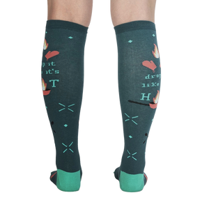 Back view of the 'Drop It Like It's Hot' socks showing the full design on both socks. The teal color and whimsical graphics are clearly visible.