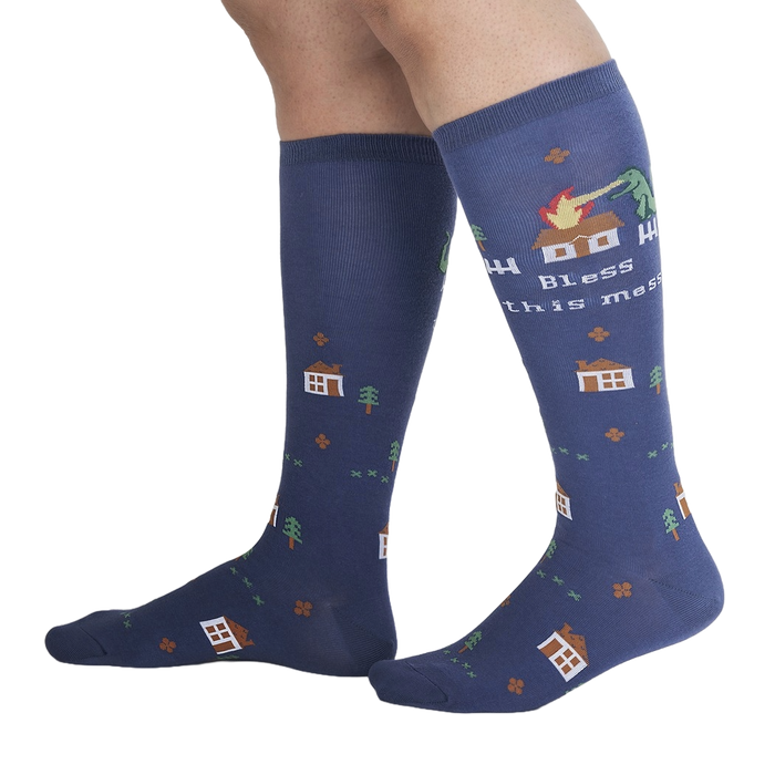Lifestyle shot of 'Bless This Mess' socks on a person's legs, showcasing the sock's length and design.