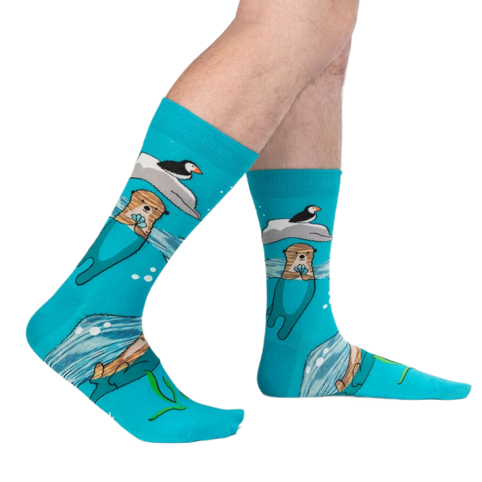 Lifestyle shot of a person's legs wearing the 'Plays Well With Otters' socks, showcasing the full design.