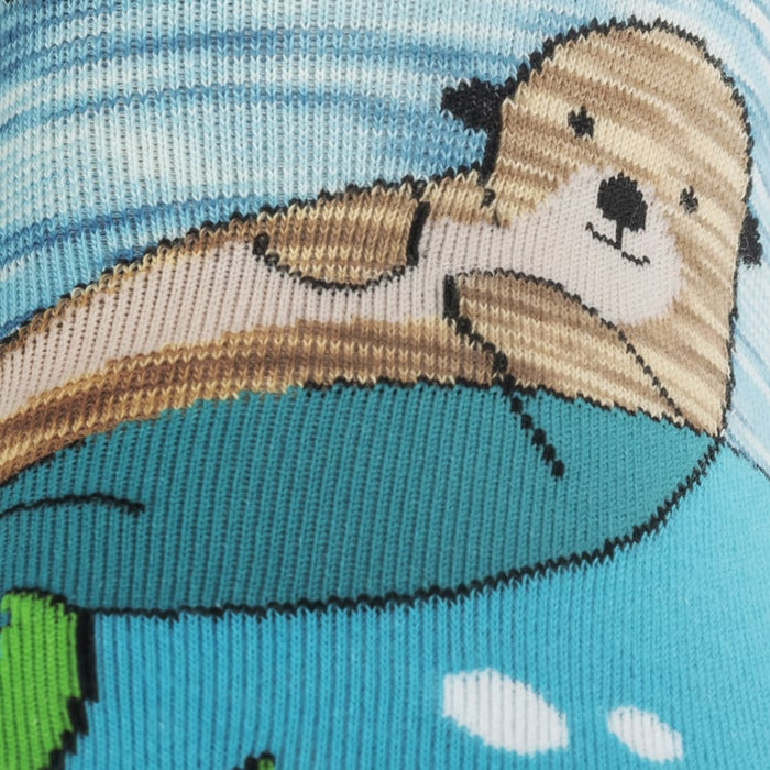 Close-up detail of the sock's knit texture and an otter design.