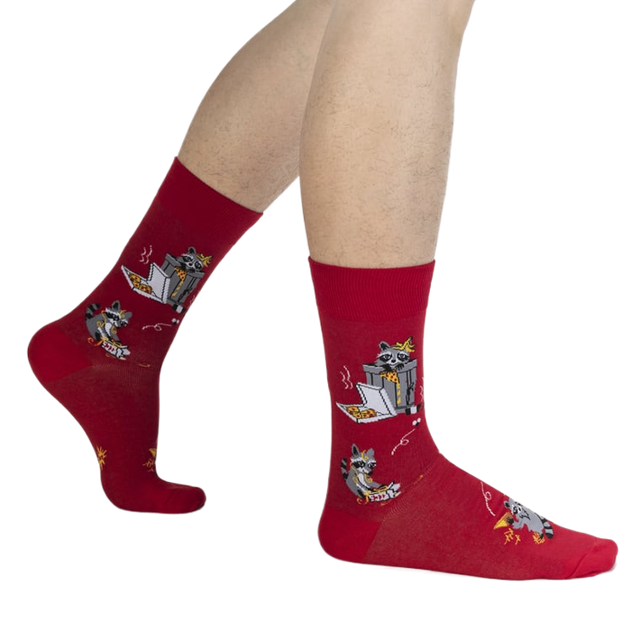 Lifestyle shot of a person's legs wearing the red Trash Panda socks.