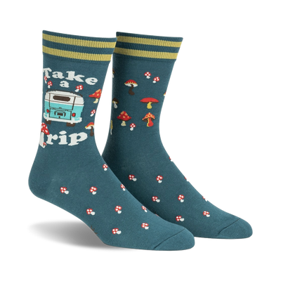 Pair of teal crew socks with a retro camper van, mushrooms, and the text 'Take a Trip'. Yellow and green stripes at the cuff.