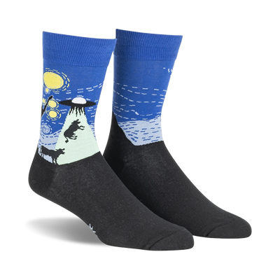 Pair of crew socks in navy blue and black, depicting a whimsical UFO scene against a starry night sky.