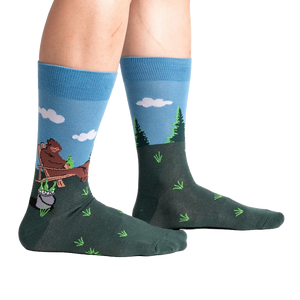 Lifestyle shot of 'Bucket List' socks on a person's legs, showing the socks' fit and design.