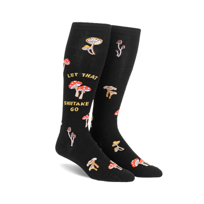 Pair of black knee-high socks with a whimsical design. Features various illustrated mushrooms and the text 'Let That Shiitake Go'.