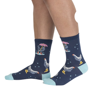 Lifestyle shot of a person's legs wearing the Chicken Little socks, highlighting the fit and pattern.