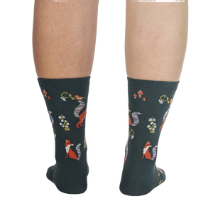 Back view of the socks on a person's legs, showcasing the full design repeat.