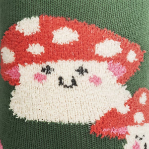 Close-up detail of a single mushroom on the sock, showing the cute face and textured knit.