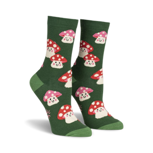 Pair of women's crew socks. Green background with repeating pattern of cute, smiling red and pink mushrooms.