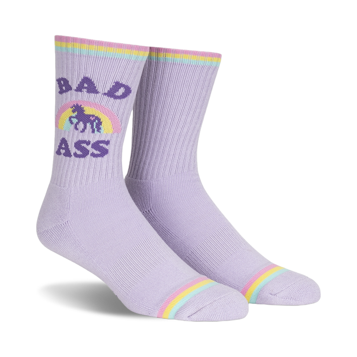 Pair of lavender crew socks with a pastel rainbow, unicorn, and 'Bad Ass' text.