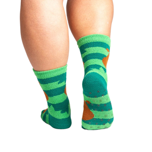 Back view of the socks showing grippers on the bottom. The socks are teal and green with brown sloths.
