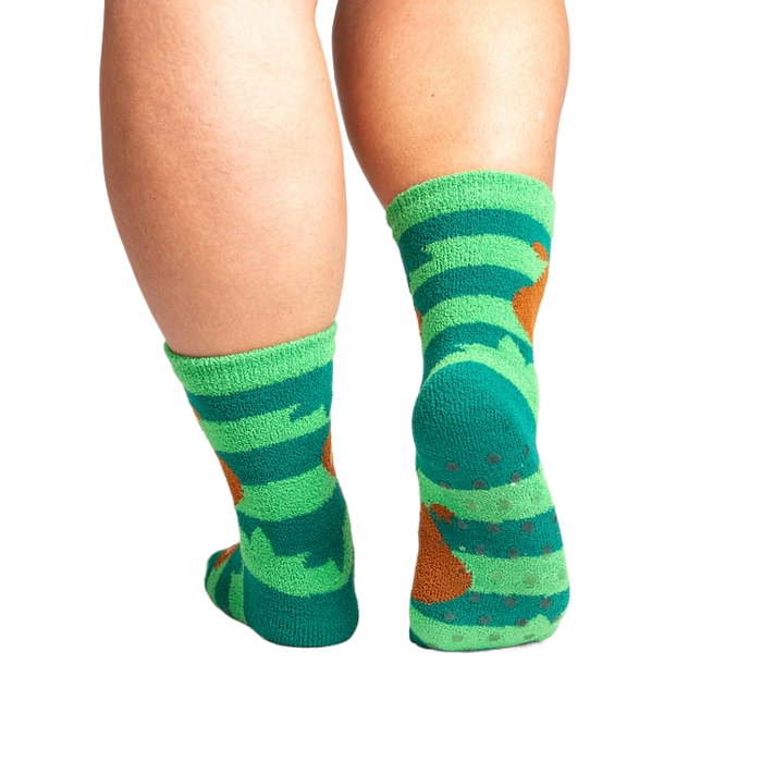Back view of the socks showing grippers on the bottom. The socks are teal and green with brown sloths.