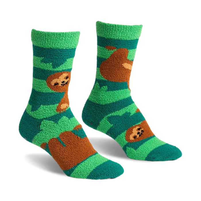Pair of teal and green fuzzy slipper socks with brown sloths hanging from branches. Crew-length socks with grippers on the bottom.