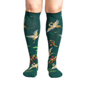 Close-up of a person's legs wearing the Flying Cranes knee-high socks; showcasing the full design on the legs.