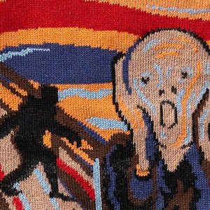 Detailed close-up of the knitted artwork on the socks, emphasizing the intricate details of The Scream.
