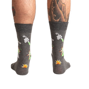 Back view of the Weird Science socks on a model, showing the full design on both socks.
