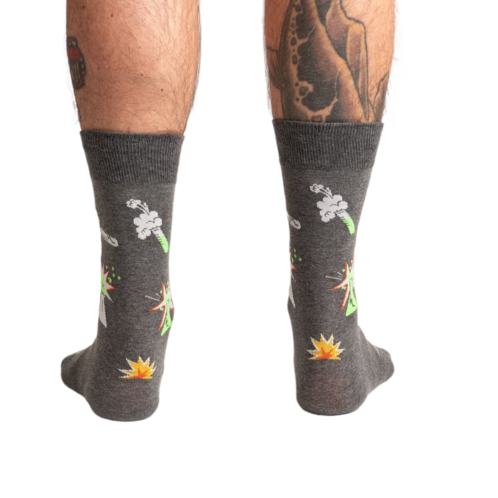 Back view of the Weird Science socks on a model, showing the full design on both socks.