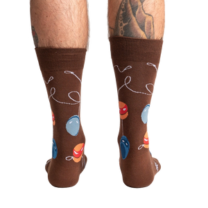 Rear view of a man's legs wearing the brown yo-yo socks.