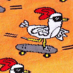 Close-up detail shot of a skateboarding chicken on the Rad Chicken socks, showcasing the design's intricate details.