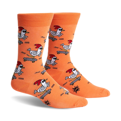 Pair of orange crew socks featuring a repeating pattern of chickens skateboarding. The chickens wear shades and red combs.