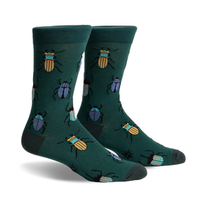 A pair of crew socks in deep green with a whimsical pattern of colorful beetles.