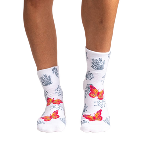 Back view of women's white ankle socks showcasing the butterfly and floral print.