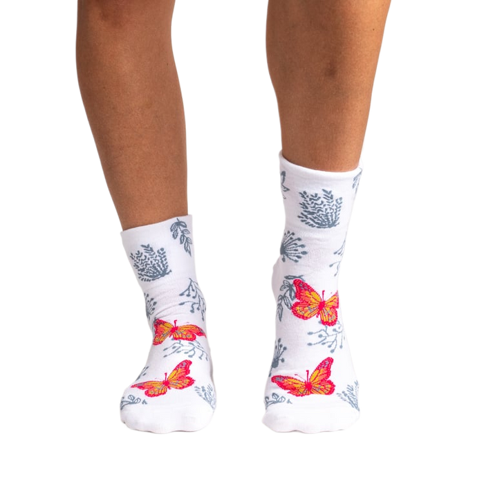 Back view of women's white ankle socks showcasing the butterfly and floral print.