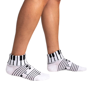 Lifestyle shot showing the socks on a person's legs, highlighting their fit and style.