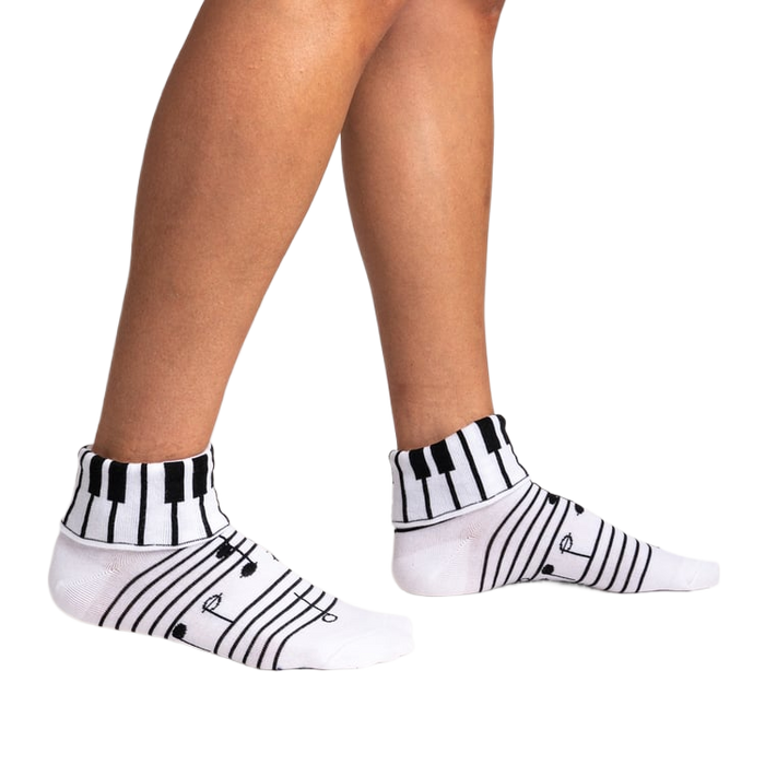 Lifestyle shot showing the socks on a person's legs, highlighting their fit and style.