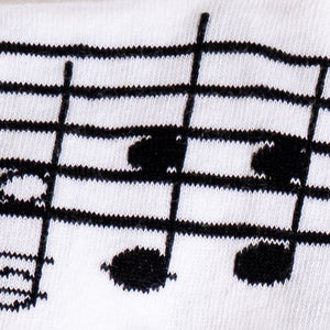 Close-up detail shot of the musical note and staff pattern on the socks.