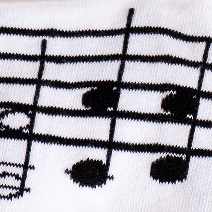Close-up detail shot of the musical note and staff pattern on the socks.